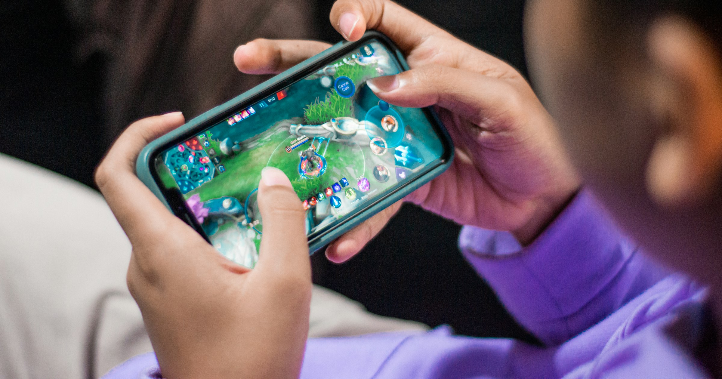 A person playing a mobile game on a phone