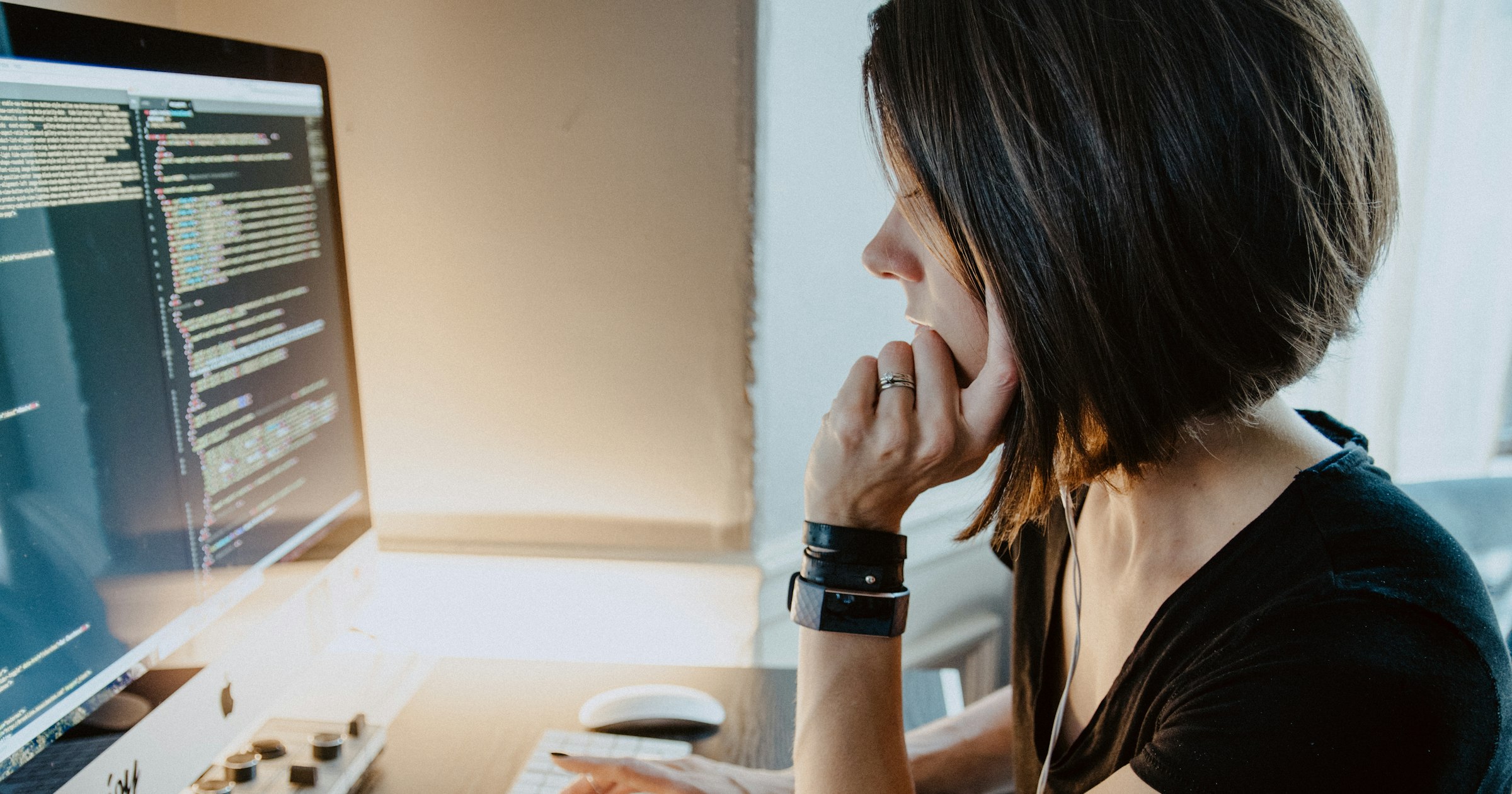 A business owner at a computer weighing options before contacting a domain squatter
