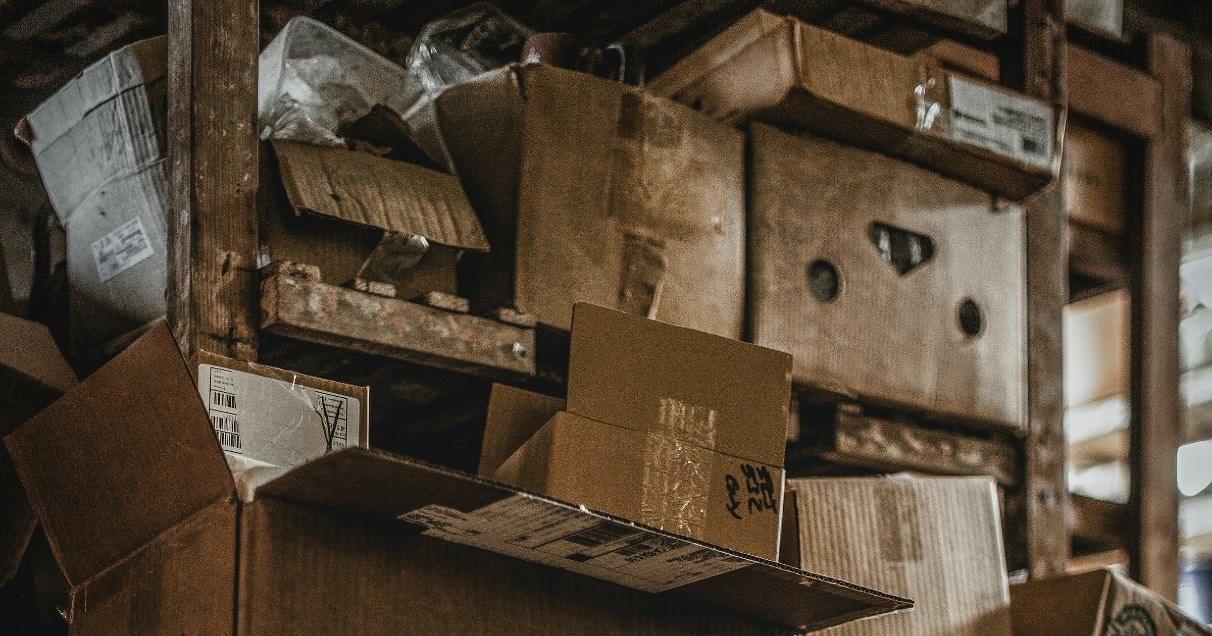 Cardboard boxes stacked on warehouse shelves