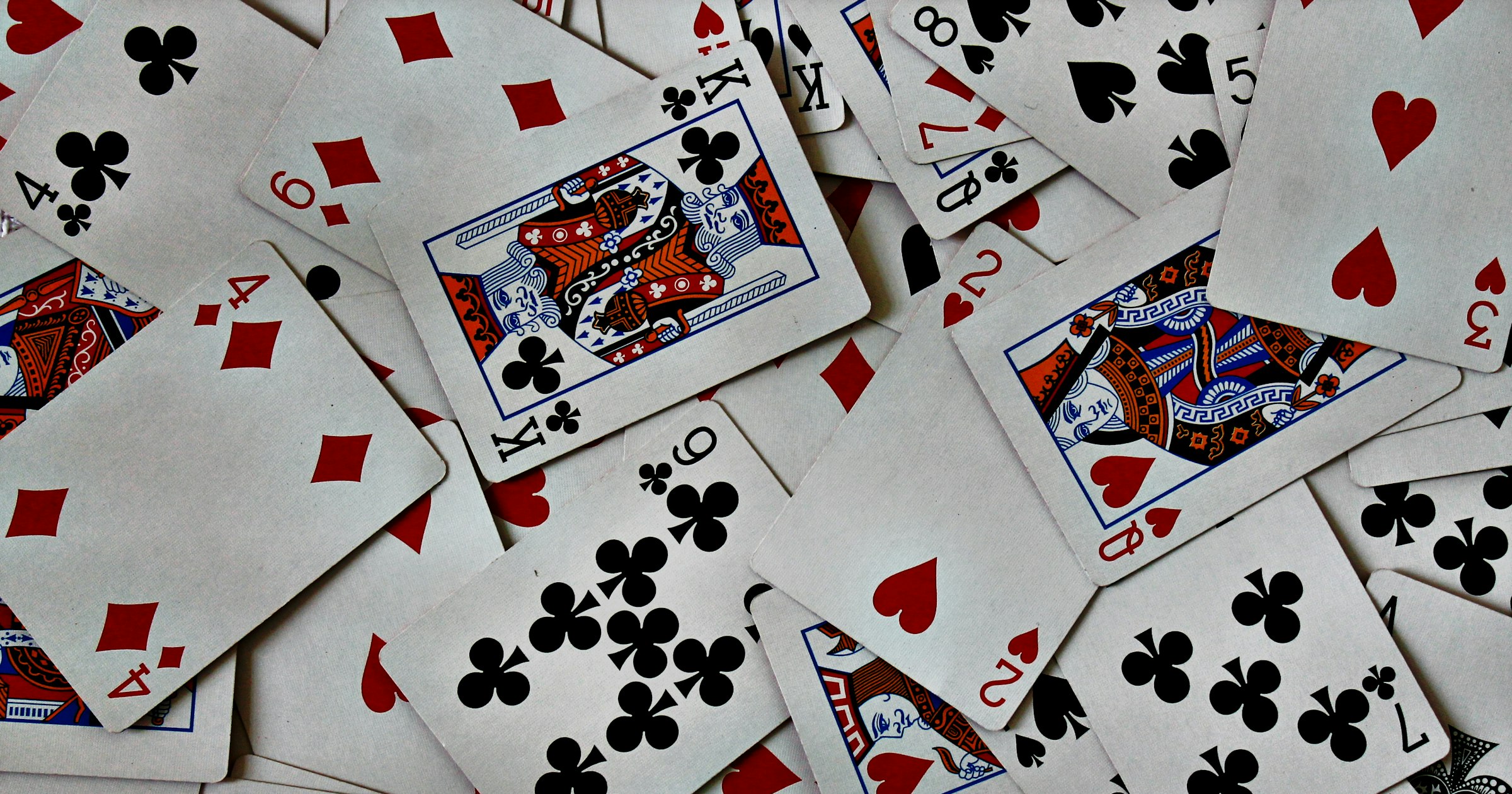 Playing cards scattered across a table